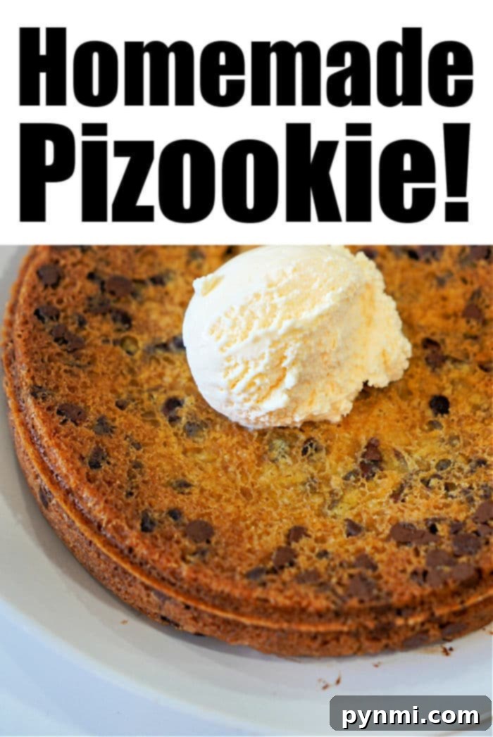 An overhead shot of a pizookie (cast iron cookie pizza) with ice cream scoops on top, ready to be served.