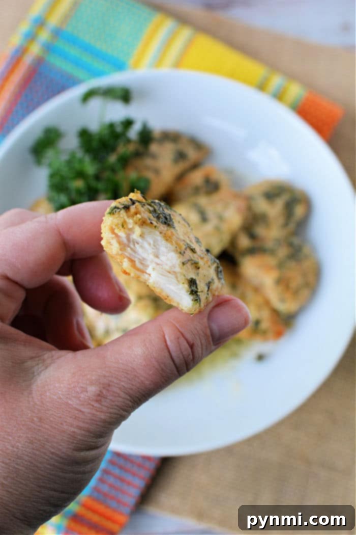 Crispy Air-Fried Boneless Chicken Bites 9 A top-down shot of a serving of crispy air fryer boneless chicken wings, beautifully plated and garnished, emphasizing their delicious appeal.