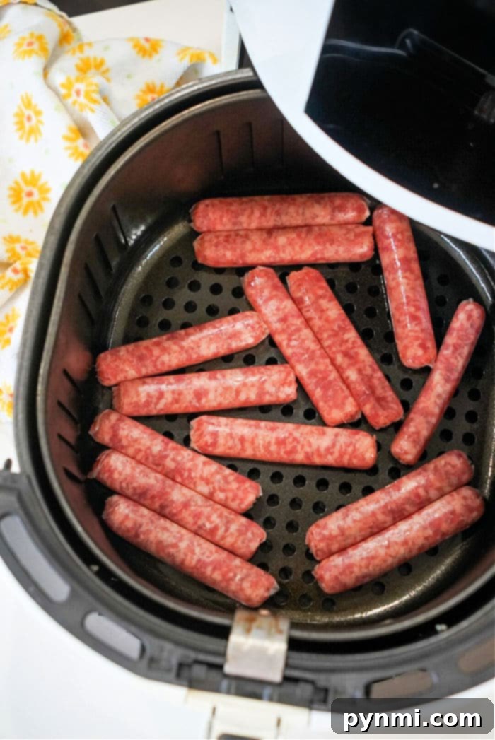 Air Fryer Sausage Perfection 7 A serving of crispy air fryer sausage links in a small bowl, garnished with fresh herbs.