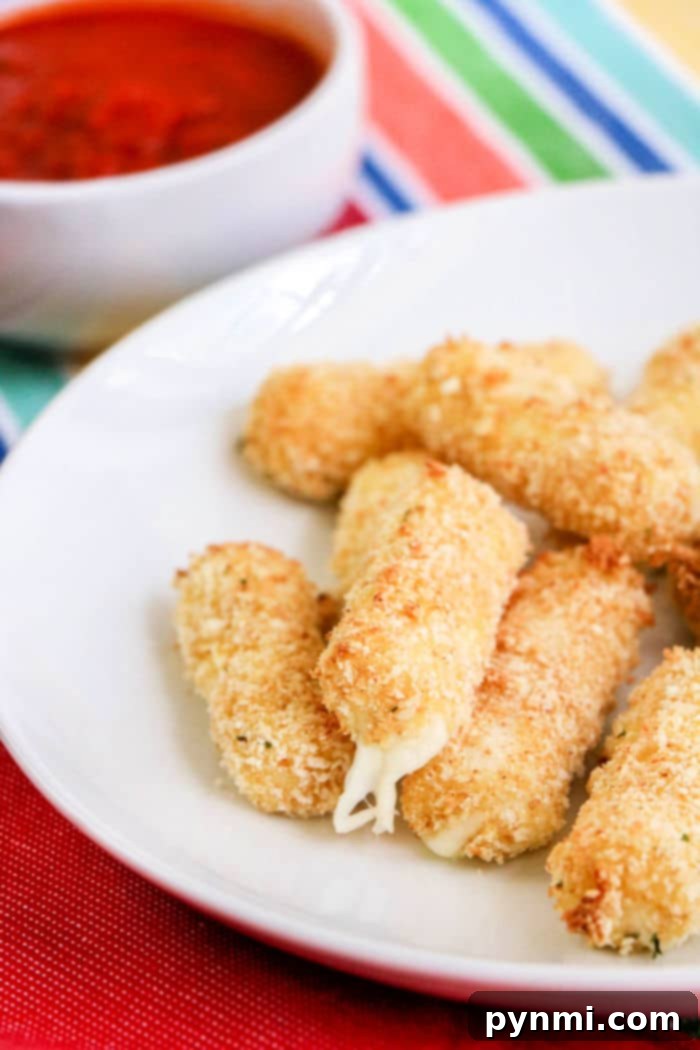 Crispy Homemade Air Fryer Mozzarella Sticks 10 Close-up of air fryer mozzarella sticks, highlighting the crisp breading and potential for a cheesy pull.