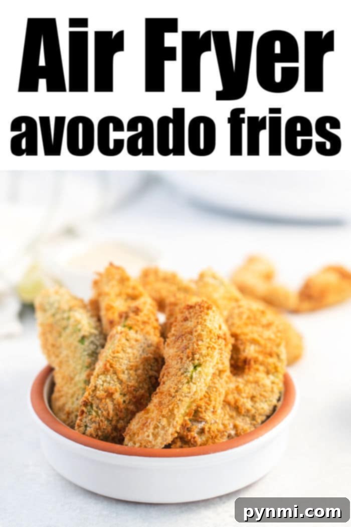 A small white bowl brimming with golden-brown air fryer avocado fries sits invitingly on a light surface. Bold black text above exclaims, "Air Fryer Avocado Fries.