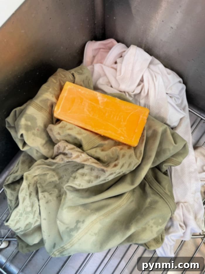 Stains visibly fading after Fels Naptha application