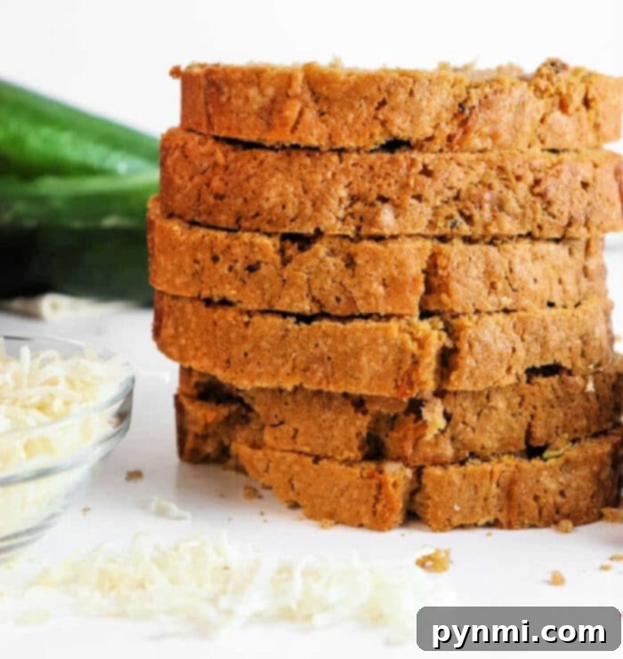 Tropical Coconut Zucchini Loaf 8 A perfectly sliced loaf of Coconut and Zucchini Bread on a vibrant blue serving plate