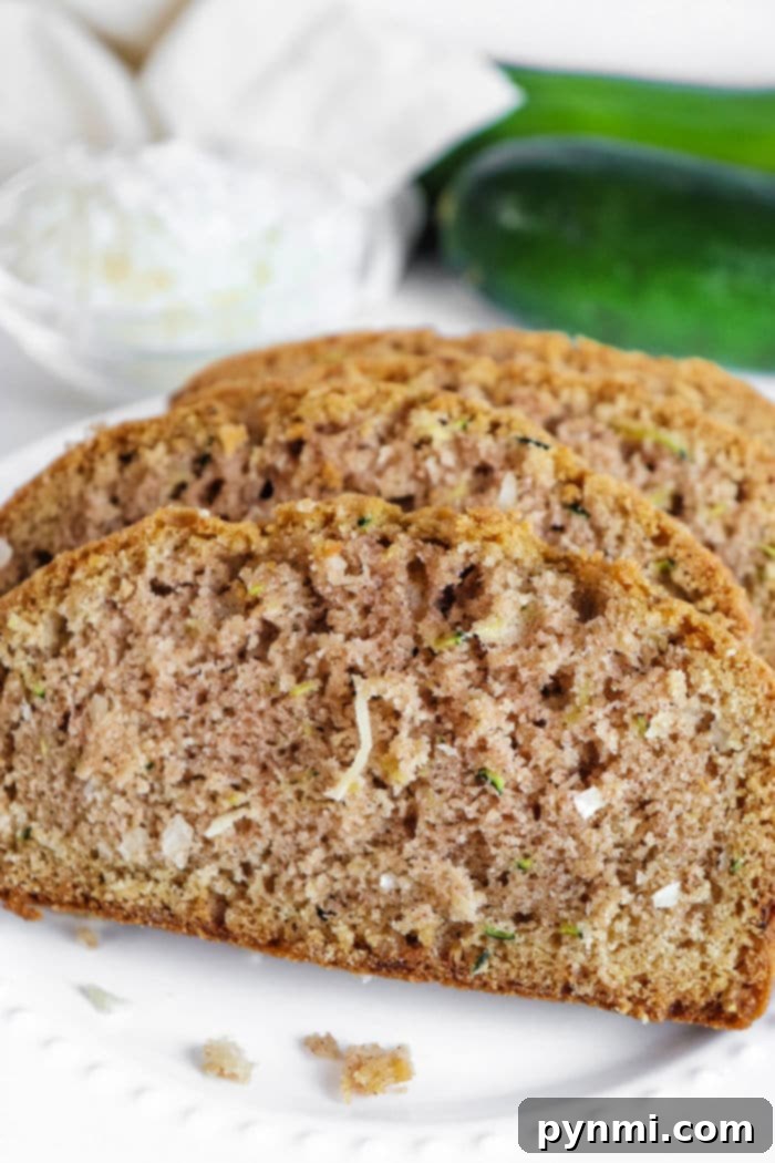 Tropical Coconut Zucchini Loaf 9 Close-up of Coconut Bread with a garnish of fresh coconut flakes