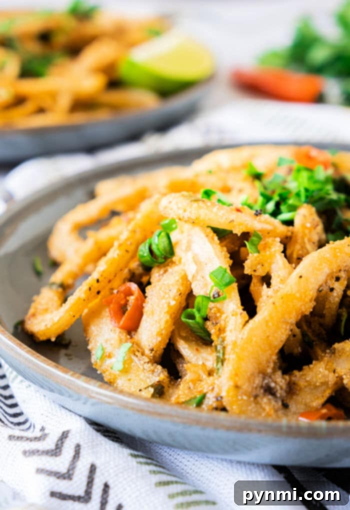 How to Cook Calamari - Perfectly fried squid rings on a plate.