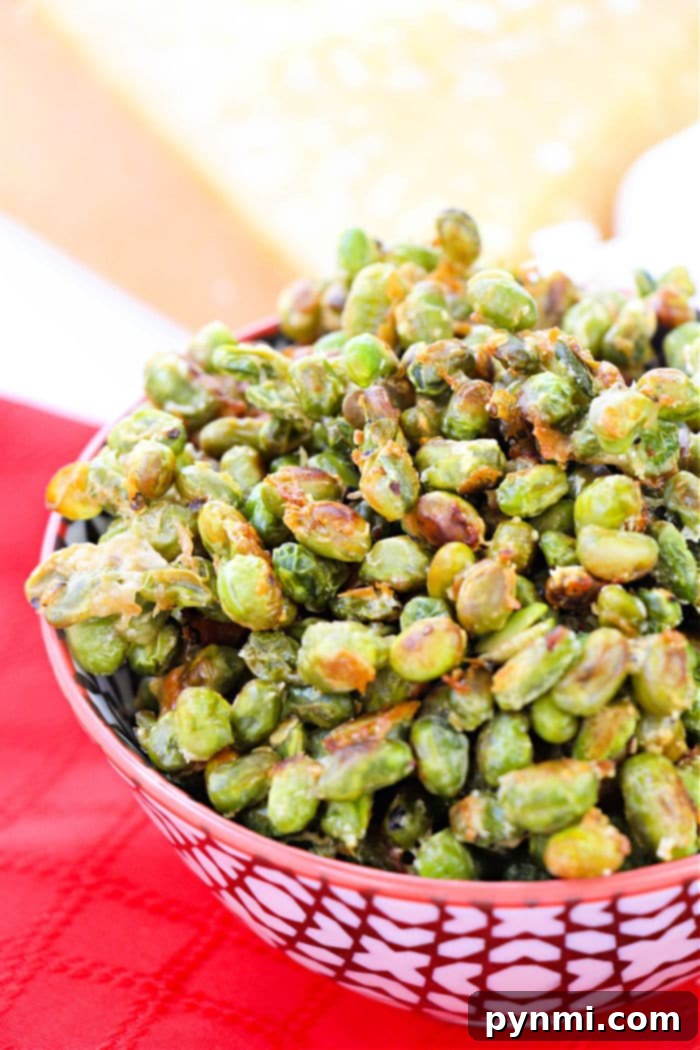 Crispy Roasted Edamame 2 A bowl of freshly roasted edamame, lightly salted, showcasing its golden-green color and inviting texture.