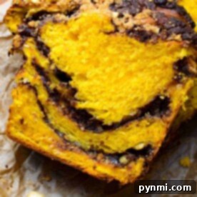 Cozy Pumpkin Babka Swirl 8 Babka-Bread-Recipe - A beautiful close-up of a sliced pumpkin babka bread.
