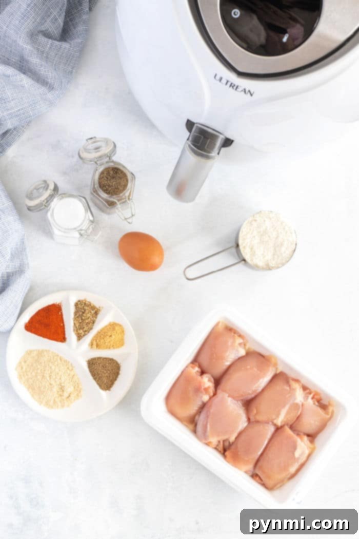 Close-up of golden-brown air fryer boneless chicken thighs, perfectly cooked with a crispy coating, showcasing the delicious result of air frying.