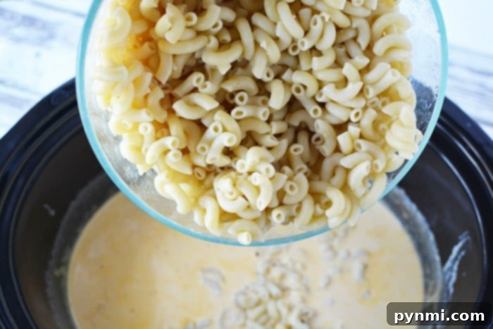 Ultimate Slow Cooker Mac and Cheese 4 Delicious homemade mac and cheese, ready to be served from the slow cooker.