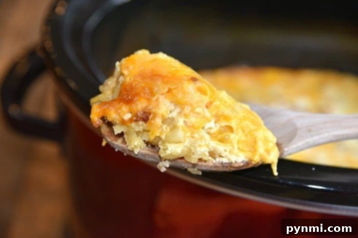 Ultimate Slow Cooker Mac and Cheese 6 The perfect scoop of cheesy, gooey mac and cheese from the crockpot.
