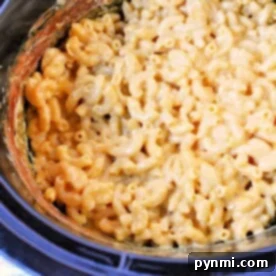 Crockpot Macaroni and Cheese with Evaporated Milk is a delightful dish, featuring creamy, melted cheese perfectly coating the pasta in a slow cooker.
