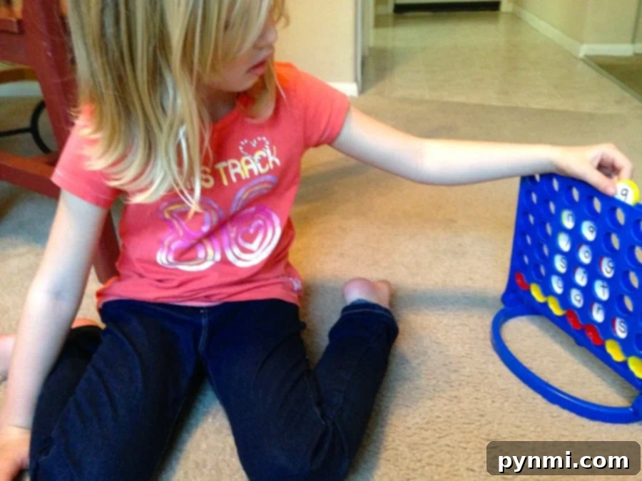 Essential materials for your DIY Connect 4 spelling game. Get ready to create educational fun! #DIYgames #spellingforkids #learningresources Materials laid out for creating a DIY Connect 4 spelling game: Connect 4, stickers, pen, scissors, and Sharpie.