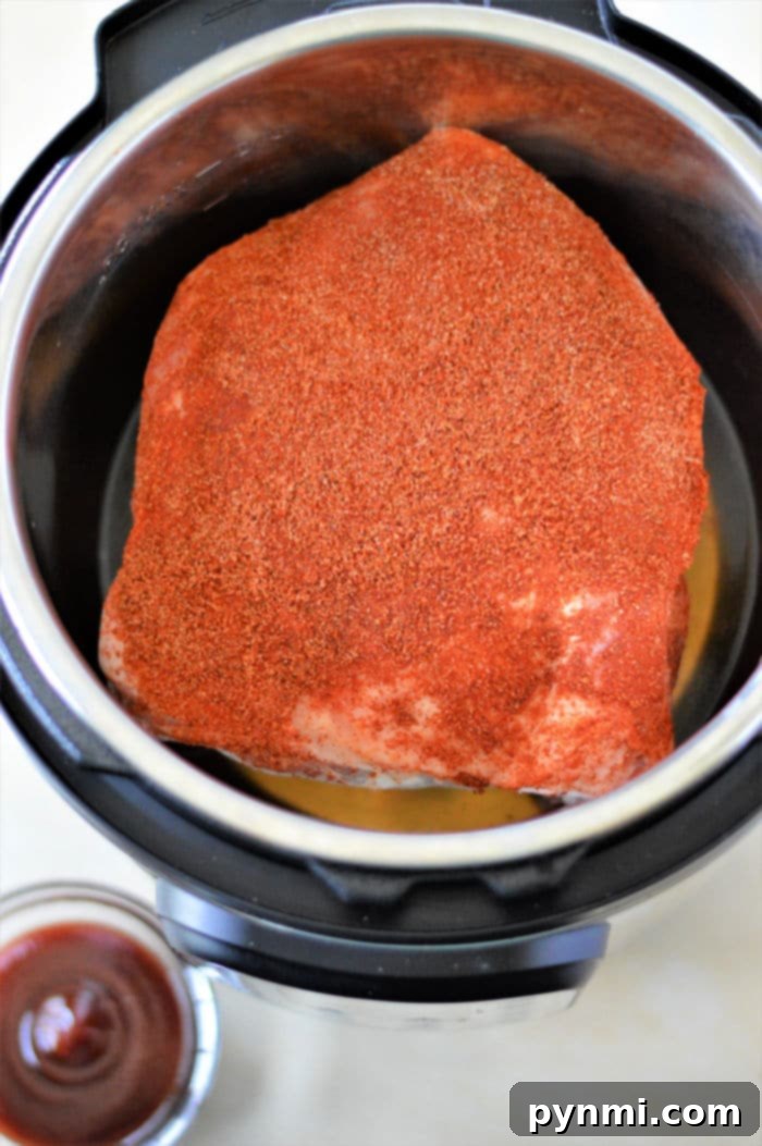 Pressure cooker frozen pork butt, shredded and sauced