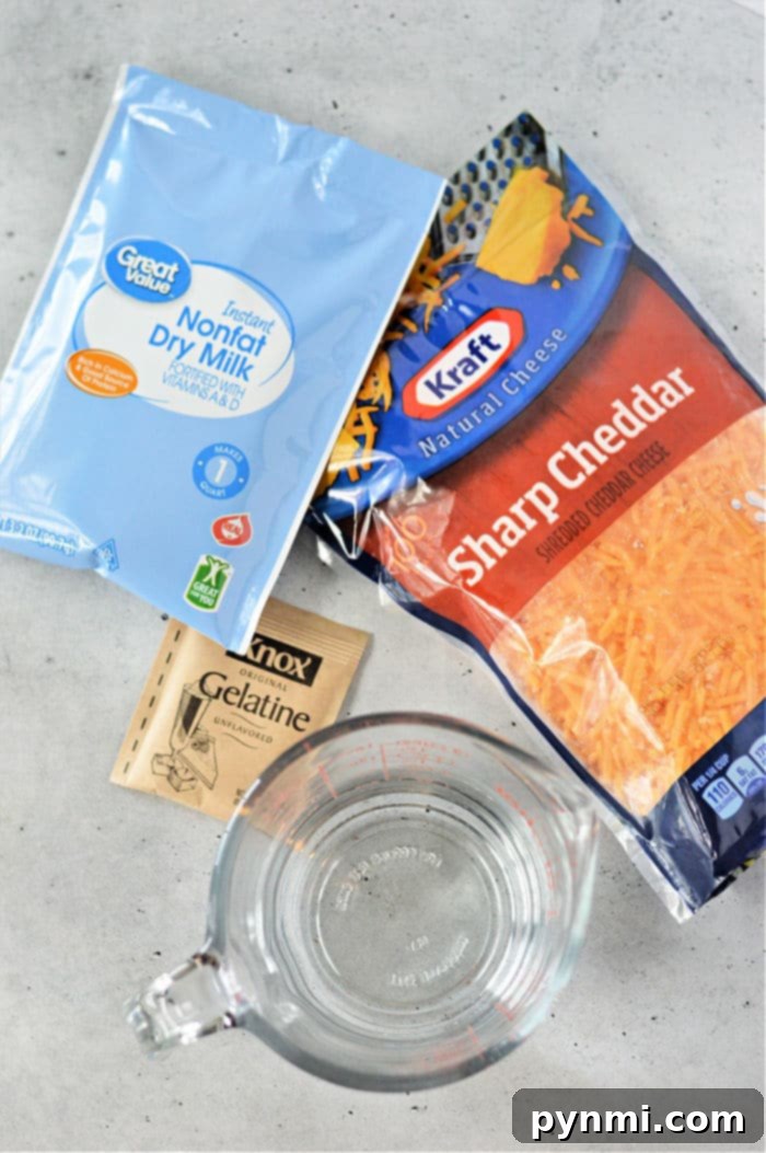 Whip Up Perfect Velveeta Cheese Sauce Every Time 3 Velvetta copycat recipe mixture in a bowl with a spoon, showing its creamy texture.