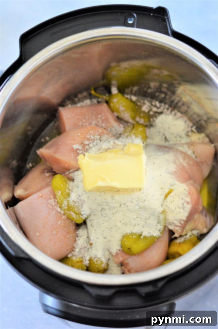 Easy Instant Pot Mississippi Chicken 5 Pepperoncini chicken in Instant Pot