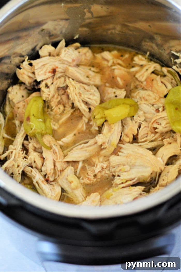 Easy Instant Pot Mississippi Chicken 7 Shredded chicken in Instant Pot serving suggestion