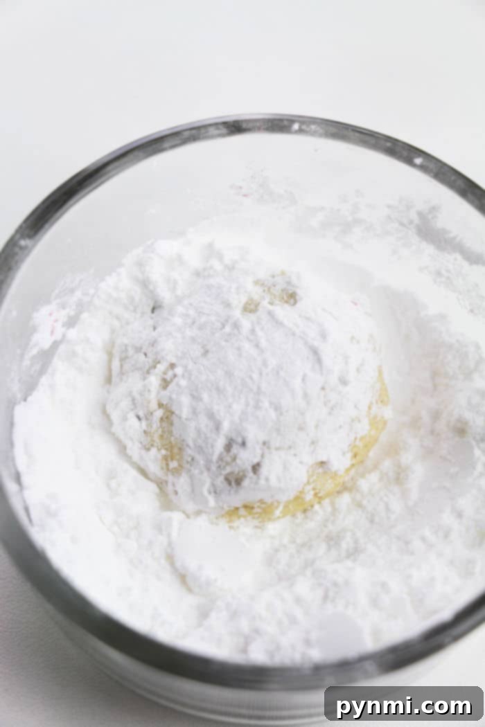 Several cake mix cookies arranged on a baking sheet, showcasing their soft texture.