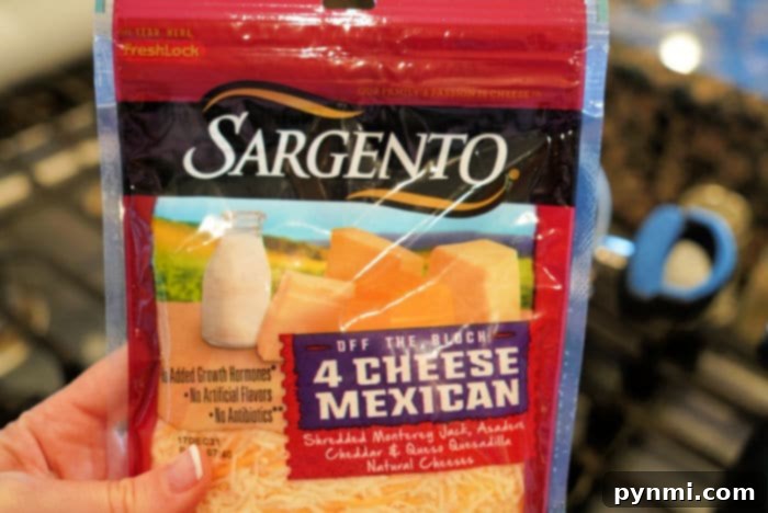 A close-up of shredded Mexican cheese blend, ready to be sprinkled over a casserole.