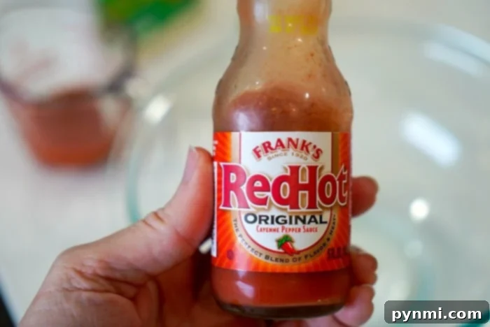 Hot sauce in a bowl, perfect for dipping chicken wings
