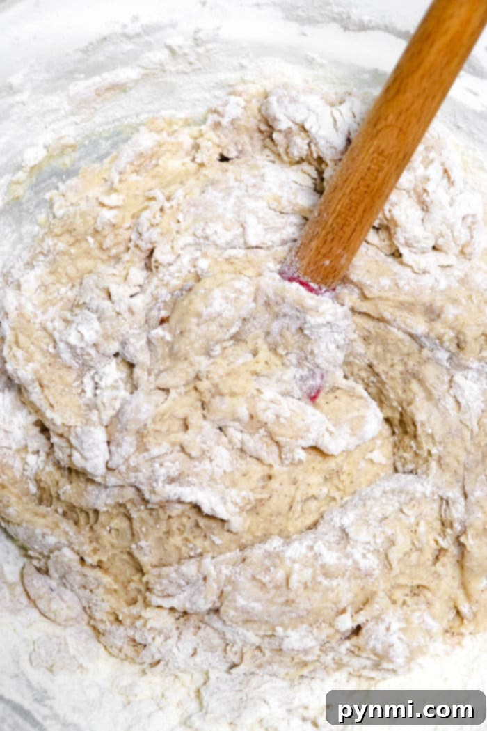 Sweet Cinnamon Swirl Muffins 3 Close-up of muffin batter in a bowl, showing a smooth, creamy texture before baking.