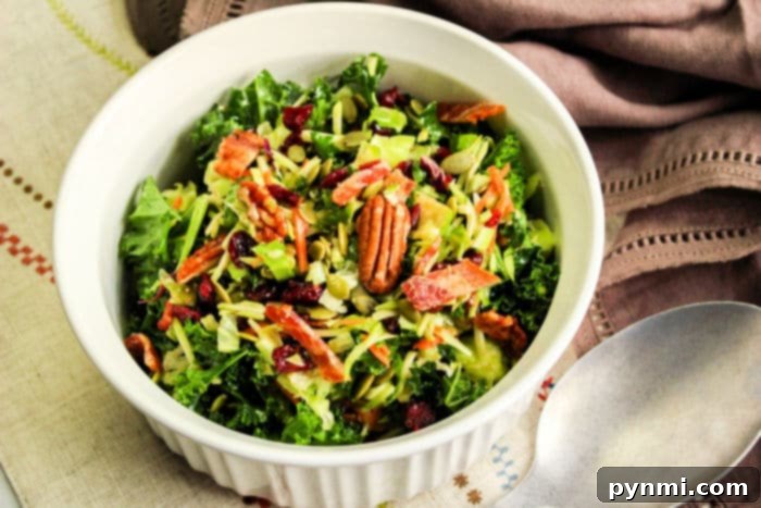 A vibrant, fresh Brussels Sprout and Kale Salad in a serving bowl, ready to be enjoyed.