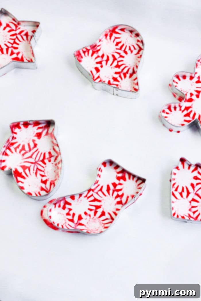 Peppermint's Sweet Dissolve 5 Close-up of a perfectly formed peppermint candy Christmas ornament, featuring a neat hole for hanging, highlighting finished peppermint christmas ornaments.