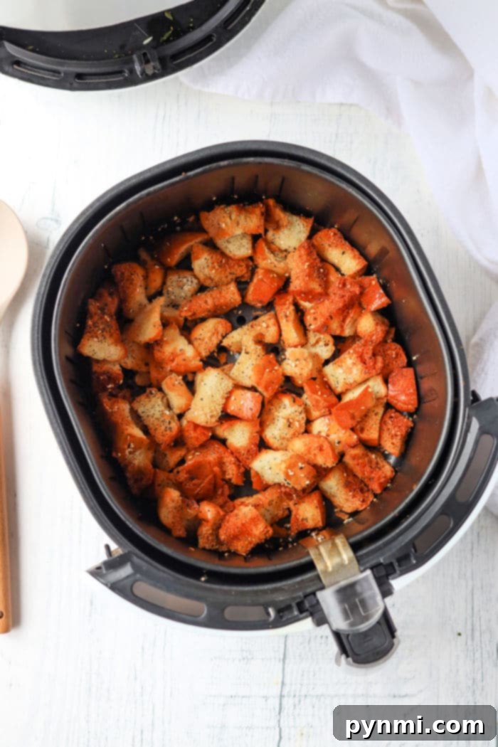A bowl of delicious Ninja Foodi croutons, perfectly toasted and seasoned, ready for serving.