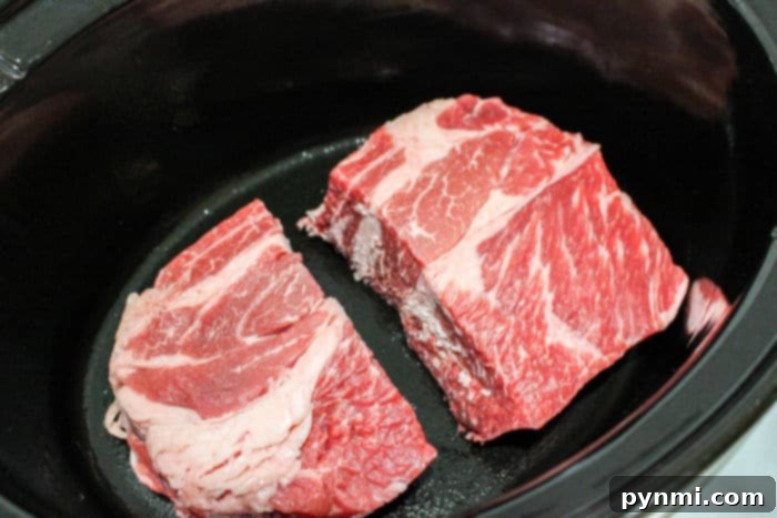 Close-up of crockpot roast beef, shredded and ready to serve