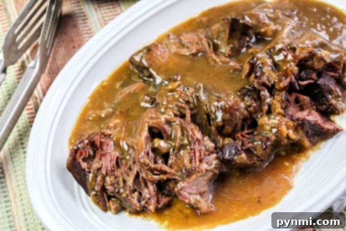 Moist slow cooker roast beef in gravy, perfect for leftovers