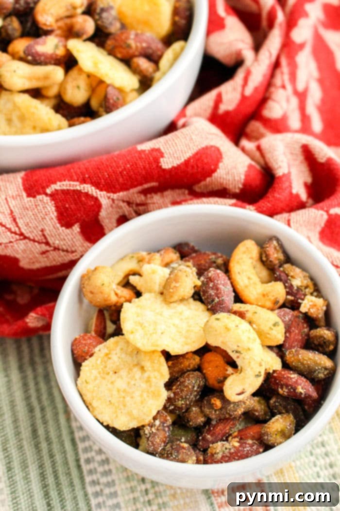 Golden Cheesy Crunch Mix 2 Delicious and savory Cheese It snack mix with nuts, perfect for parties and gatherings.