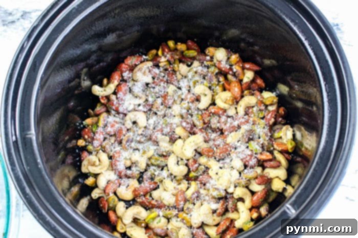 Golden Cheesy Crunch Mix 6 Slow cooker Chex mix spread out on a baking sheet to cool.