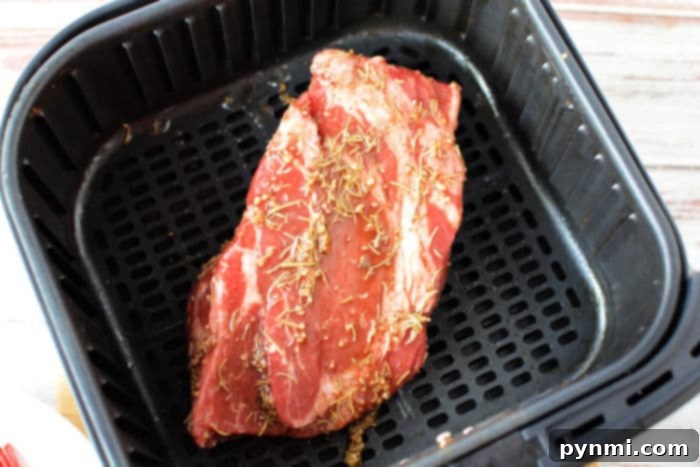 Ultimate Air Fryer Chuck Roast 5 Chuck roast cooking in a Ninja Foodi air fryer
