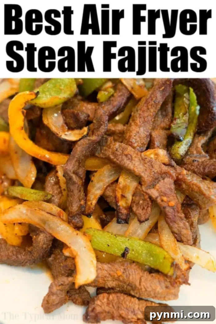 A close-up view of cooked steak fajitas featuring tender slices of steak, vibrant green and yellow bell peppers, and caramelized onions. The inviting text above proclaims, "Best Air Fryer Steak Fajitas. Discover more delicious air fryer beef recipes today!" highlighting a perfect air fryer beef meal.