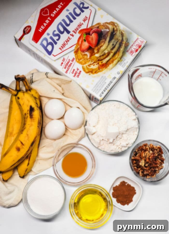 Effortless Bisquick Banana Bread 3 Essential ingredients for Bisquick banana bread including bananas, eggs, Bisquick mix, milk, flour, pecans, vanilla, cinnamon, sugar, and oil, laid out on a table.
