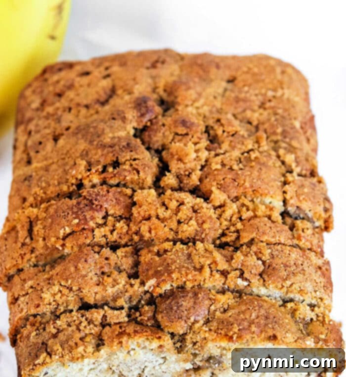 Effortless Bisquick Banana Bread 7 A freshly baked loaf of Bisquick banana bread with a perfectly golden-brown crust.