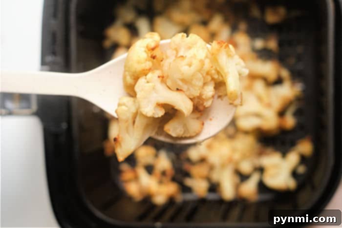 Perfectly Tender Air Fried Frozen Cauliflower 7 Perfectly air-fried frozen cauliflower, ready to be enjoyed as a side.