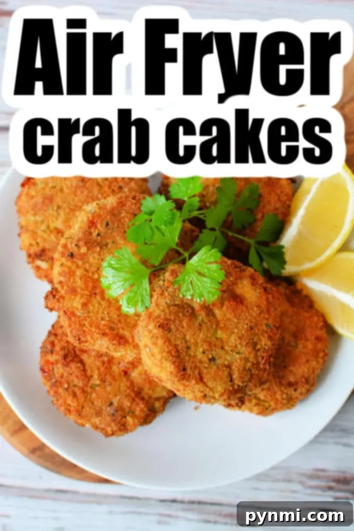 A plate of Air Fryer Crab Cakes is garnished with cilantro and served with lemon wedges. The text "Air Fryer Crab Cakes" is prominently displayed at the top.
