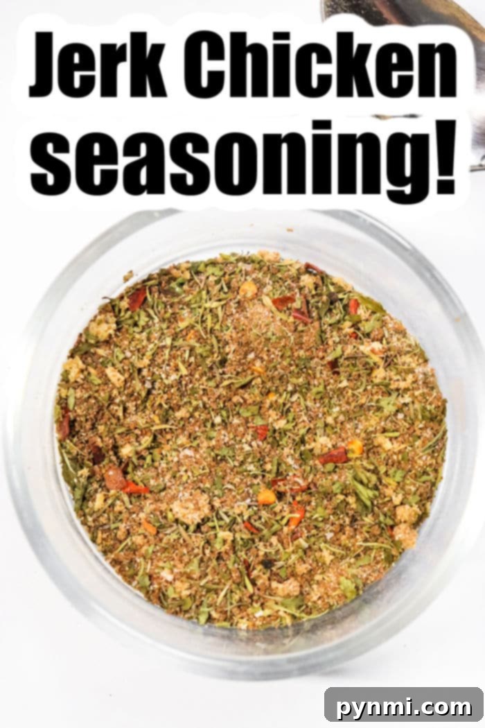 A bowl filled with homemade jerk seasoning, showcasing its rich colors and textures.