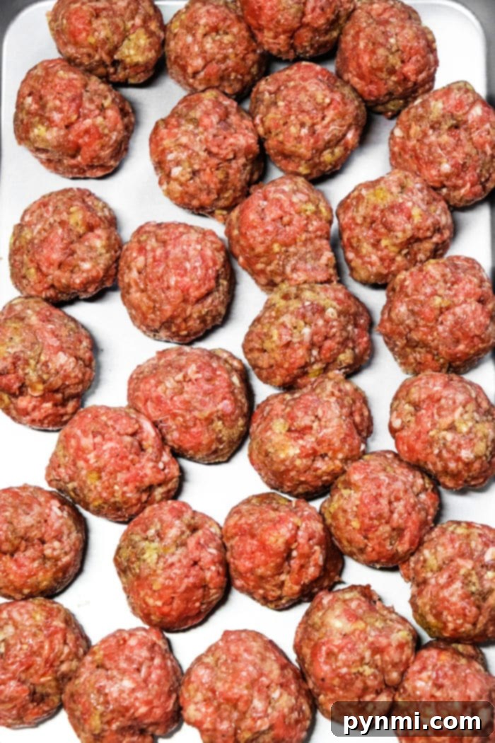 Homemade Crockpot Meatballs in a skillet before going into the slow cooker.