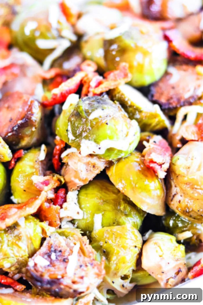 Perfectly cooked Crockpot Brussel Sprouts with crispy bacon bits, ready to serve.