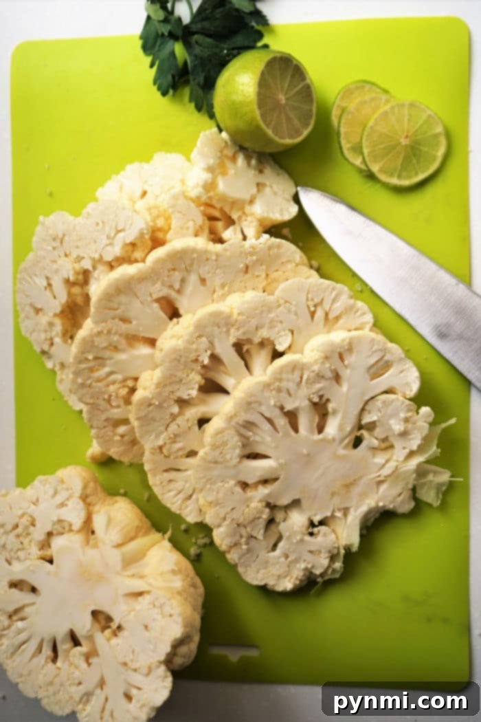 Detailed guide on how to properly cut cauliflower into steaks for cooking.