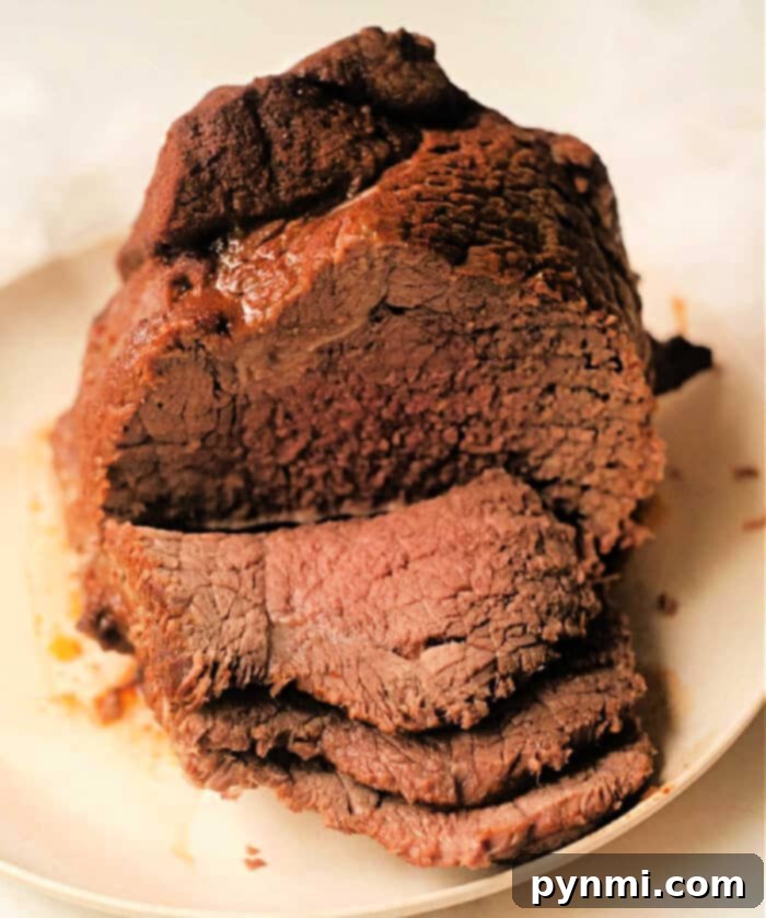 Flavorful pressure cooker Mexican pot roast, garnished with fresh cilantro.