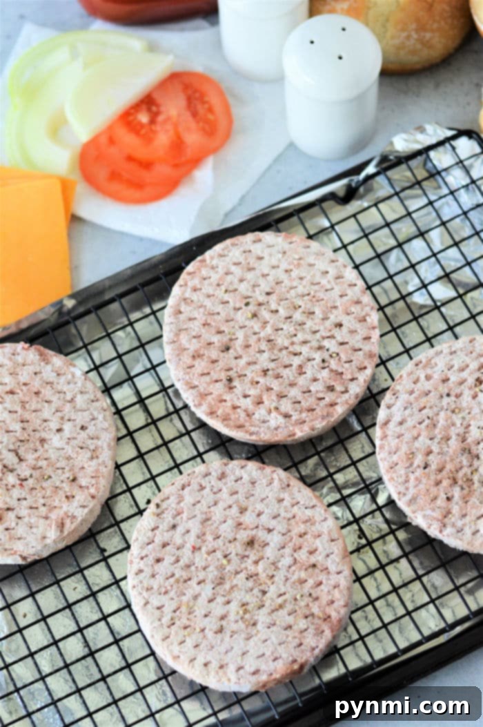 frozen hamburgers cooking in oven