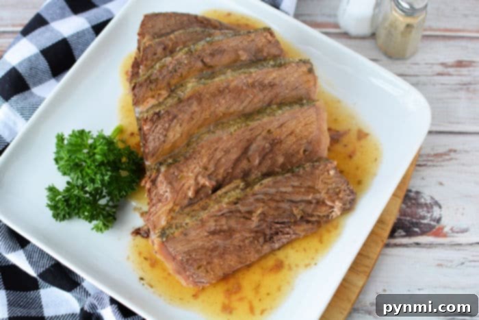 A delicious, perfectly cooked frozen roast in the oven, ready to be sliced and served.