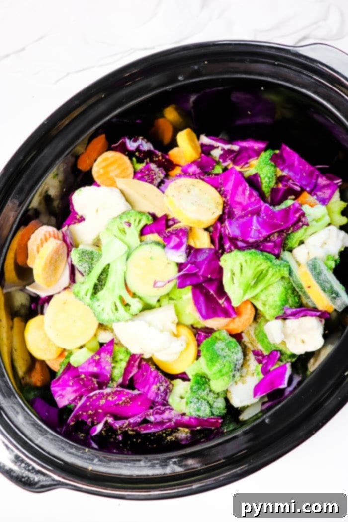 Vibrant Slow Cooker Purple Cabbage Soup 5 A rustic bowl of slow cooker Cabbage Soup, showcasing tender green cabbage pieces, carrots, and other vegetables, garnished with fresh herbs, ready to be enjoyed as a hearty and healthy meal.