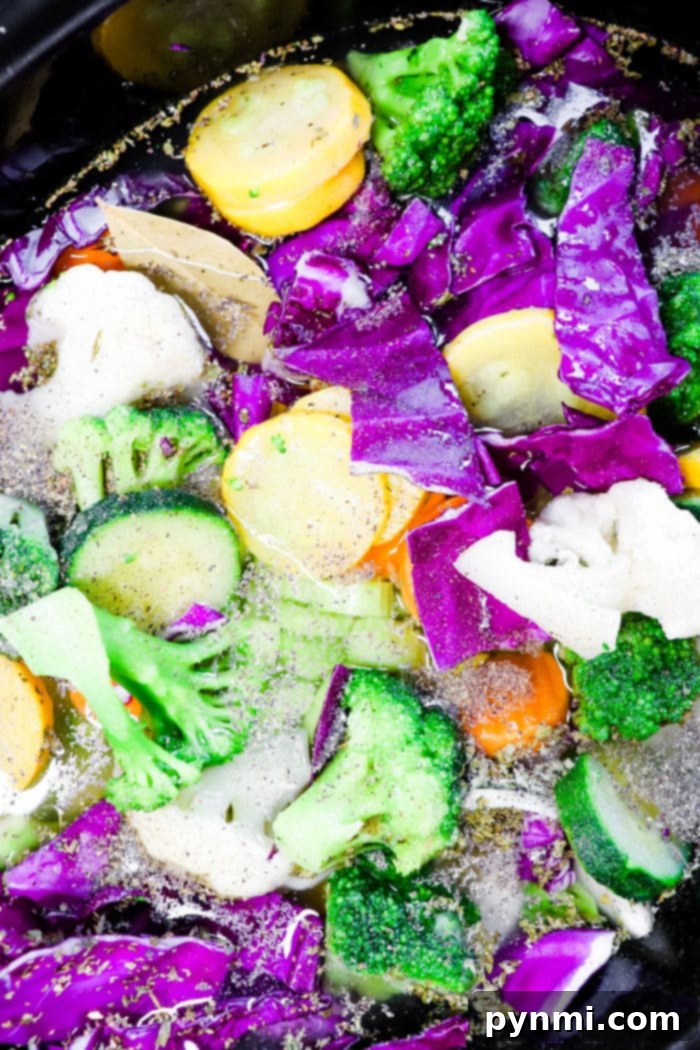 Vibrant Slow Cooker Purple Cabbage Soup 7 A large, steaming pot of hearty cabbage soup, perfect for a cold day or healthy meal prep, showcasing the rich colors of the vegetables.