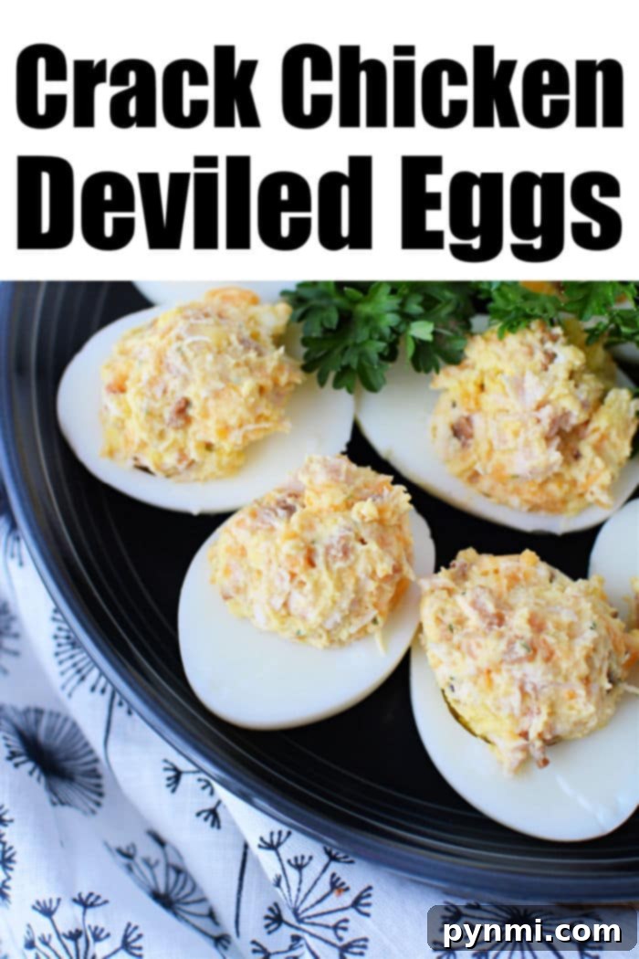 Loaded Crack Chicken Deviled Eggs 2 Plate of Crack Chicken Deviled Eggs, garnished with paprika and fresh herbs.