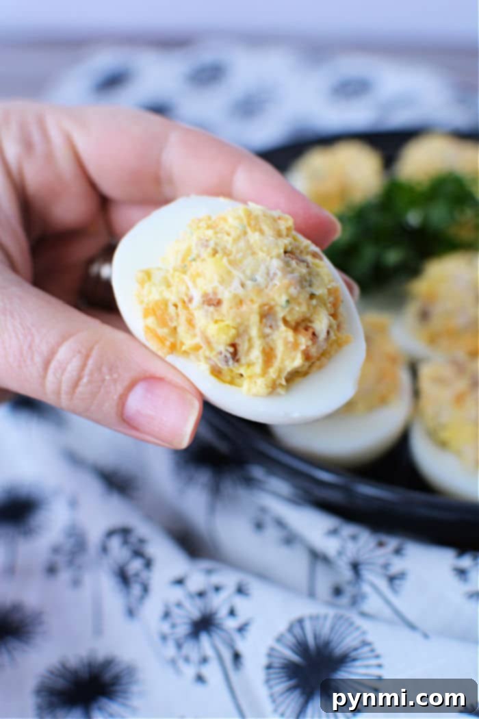 Loaded Crack Chicken Deviled Eggs 6 Several Crack Chicken Deviled Eggs on a platter, showcasing the best deviled eggs recipe.