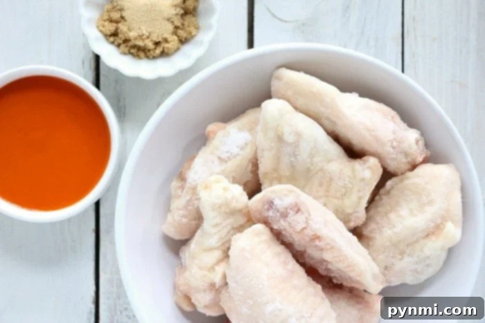 close-up of frozen chicken wings on a baking sheet
