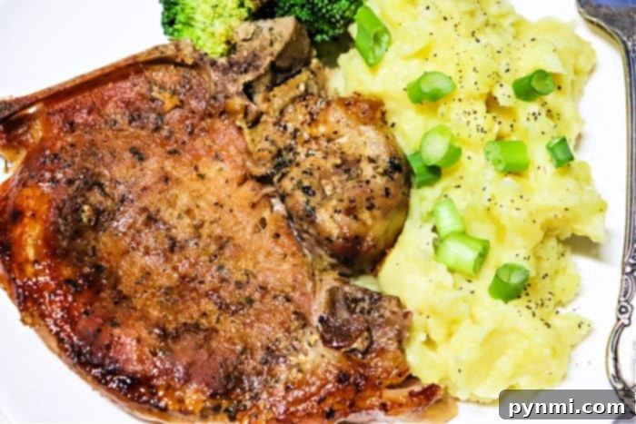 Ultimate Slow Cooker Ranch Pork Chops 7 Perfectly cooked pork chops, plated and ready to enjoy.